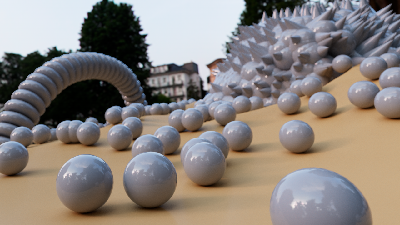 Abstract grey spheres on a sandy beach